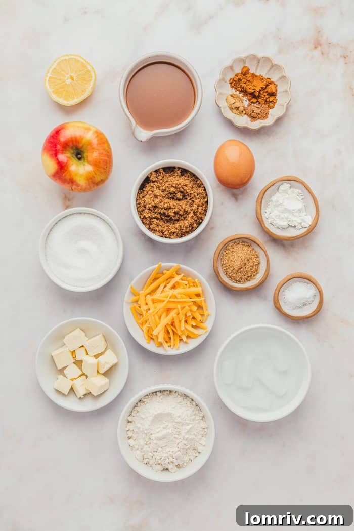 A vibrant display of various white bowls filled with the essential ingredients for baking a caramel apple pie with a cheddar crust.
