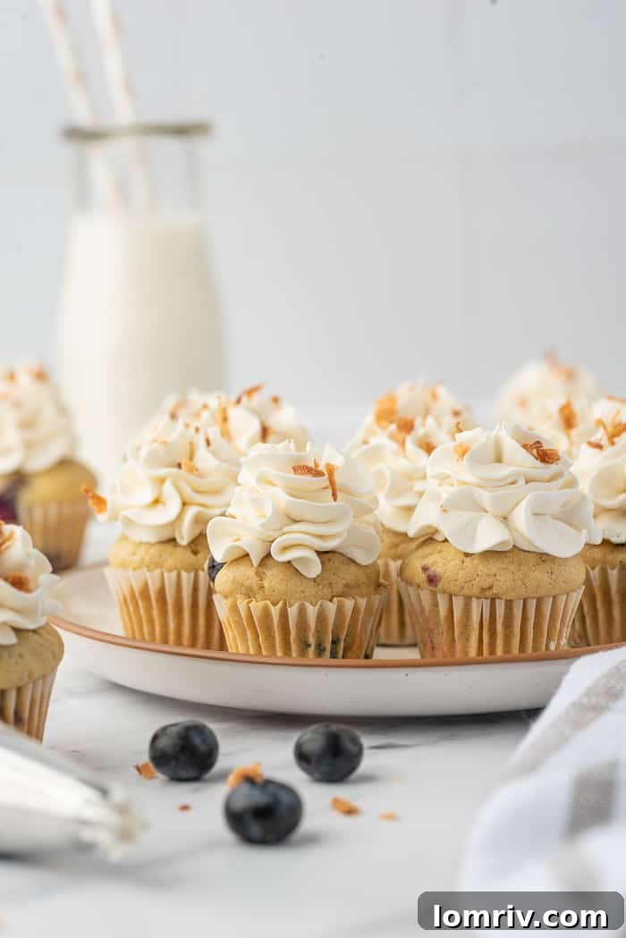 Mini Coconut Cupcakes with Blueberries on a plate
