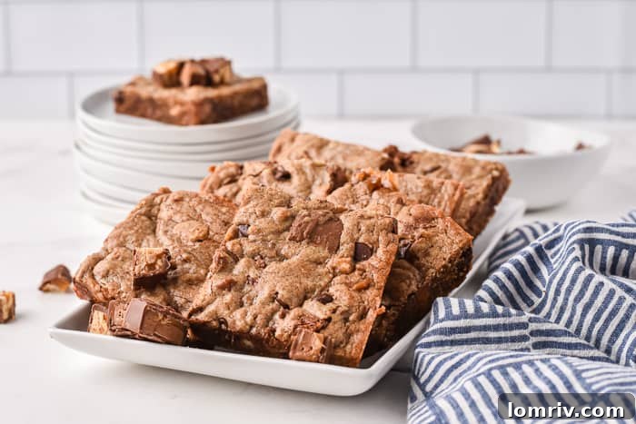 Sliced Chocolate Bar Cookie Bars showing gooey chocolate pieces