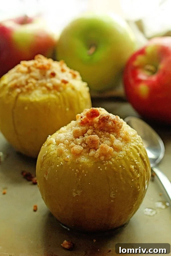 Warm and inviting baked crumble apples, a perfect individual dessert for fall gatherings or a cozy night in.