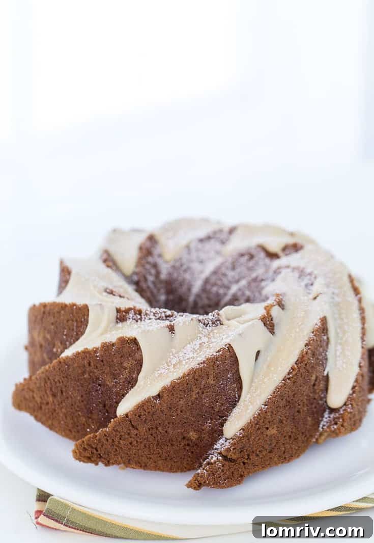 This applesauce cake with caramel glaze recipe is a moist, fluffy, light spiced cake that is topped with a sweet caramel glaze. 