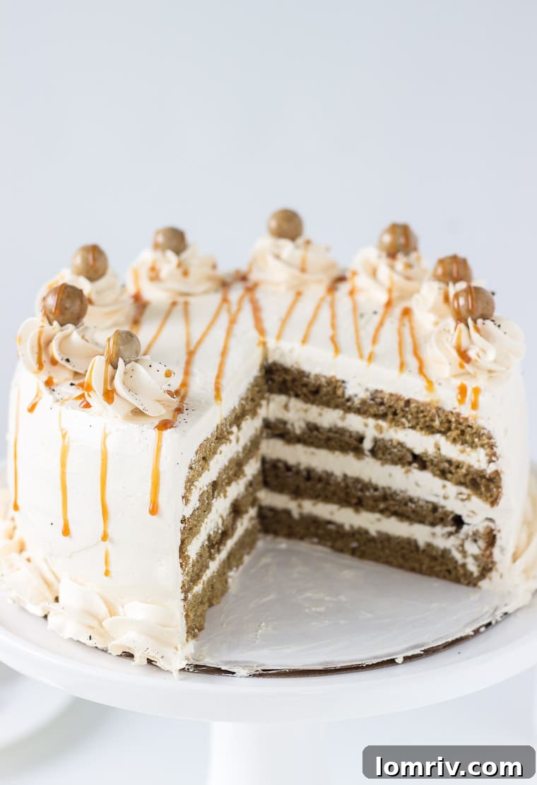 Caramel Macchiato Cake adorned with caramel drizzle and chocolate bites