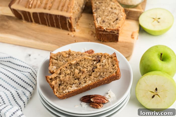 A welcoming scene of a cup of coffee next to a generous slice of Coconut Apple Bread, perfect for a relaxing moment.
