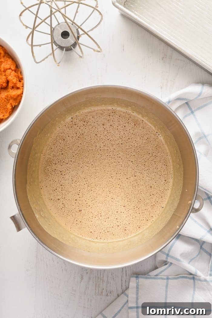 The batter fully mixed in a stand mixer.