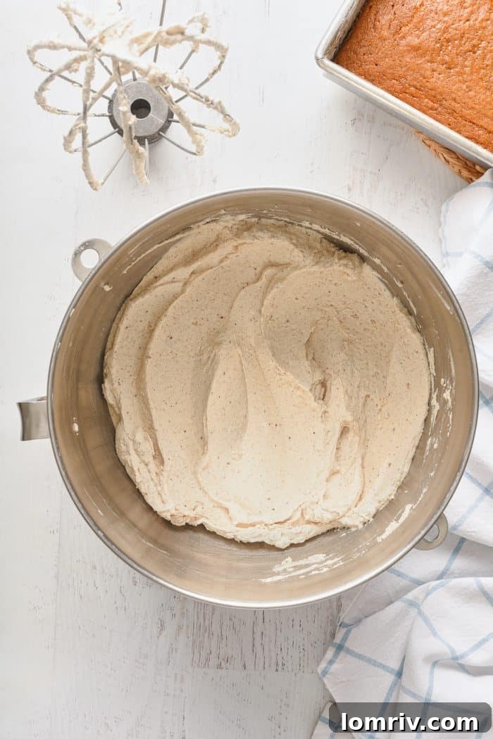 Frosting ingredients being mixed in a bowl.