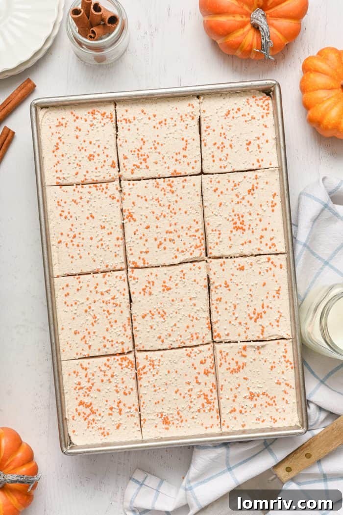 Pumpkin cake cut into uniform bars in the pan.
