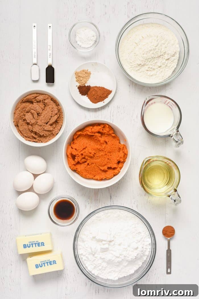 Pumpkin cake bar ingredients neatly laid out in bowls.