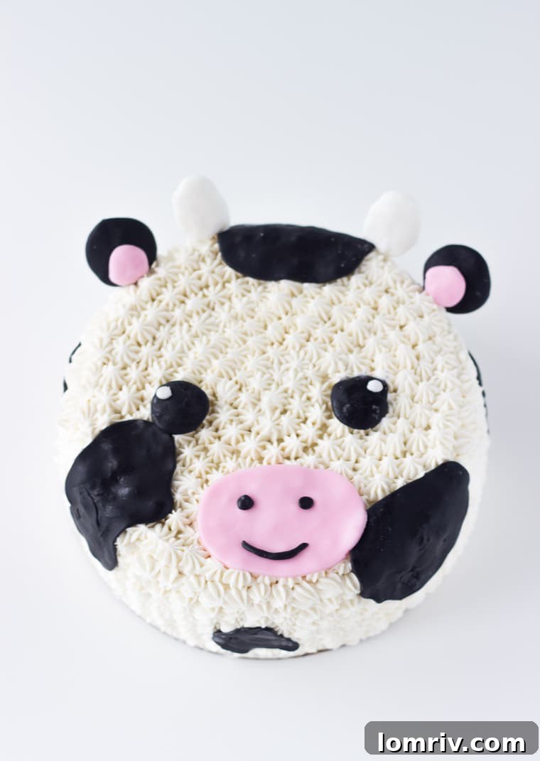 This charming cow cake tutorial provides an easy and adorable way to create a fondant and frosting decorated cow cake, perfect for any farm-themed celebration or birthday party. Discover the full recipe and decorating tips on BlahnikBaker.com.