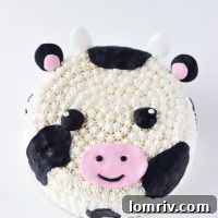 This Cow Cake tutorial makes for an easy and adorable fondant and frosting decorated cow cake; perfect for any cow-themed celebration. Get the recipe on BlahnikBaker.com