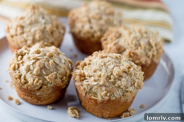 Freshly baked Apple Muffins cooling on a rack