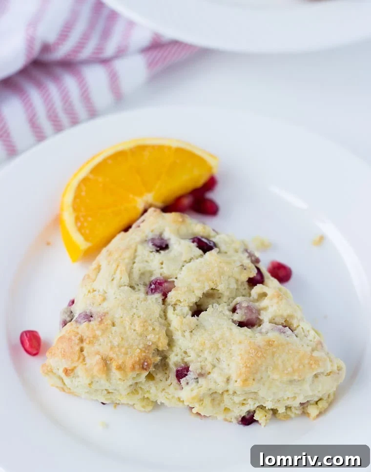Deliciously moist Pomegranate Orange Scones with a buttery, flaky texture, perfect for winter baking.