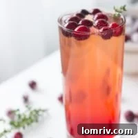 Refreshing Cranberry Thyme Sparklers made bubbly with 7UP or Ginger Ale make for a simple and easy holiday cocktail or mocktail.