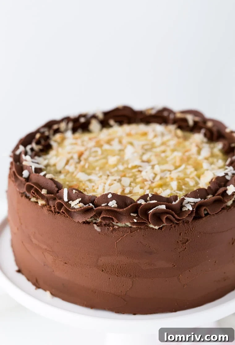Close-up of a slice of German Chocolate Cake showing the rich chocolate layers and coconut pecan filling