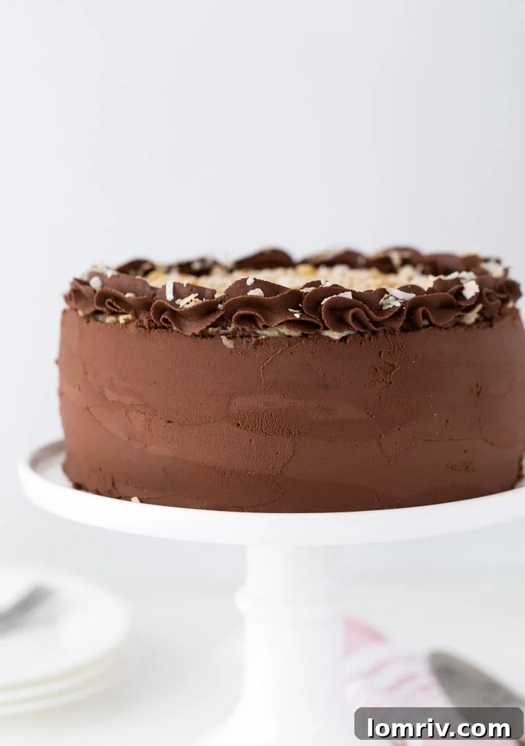Overhead view of assembled German Chocolate Cake with chocolate ganache and coconut pecan filling on top