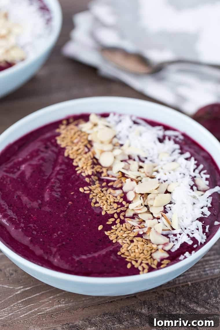 A beautifully arranged Berry Beets Smoothie Bowl with fresh ingredients, ready to be enjoyed.