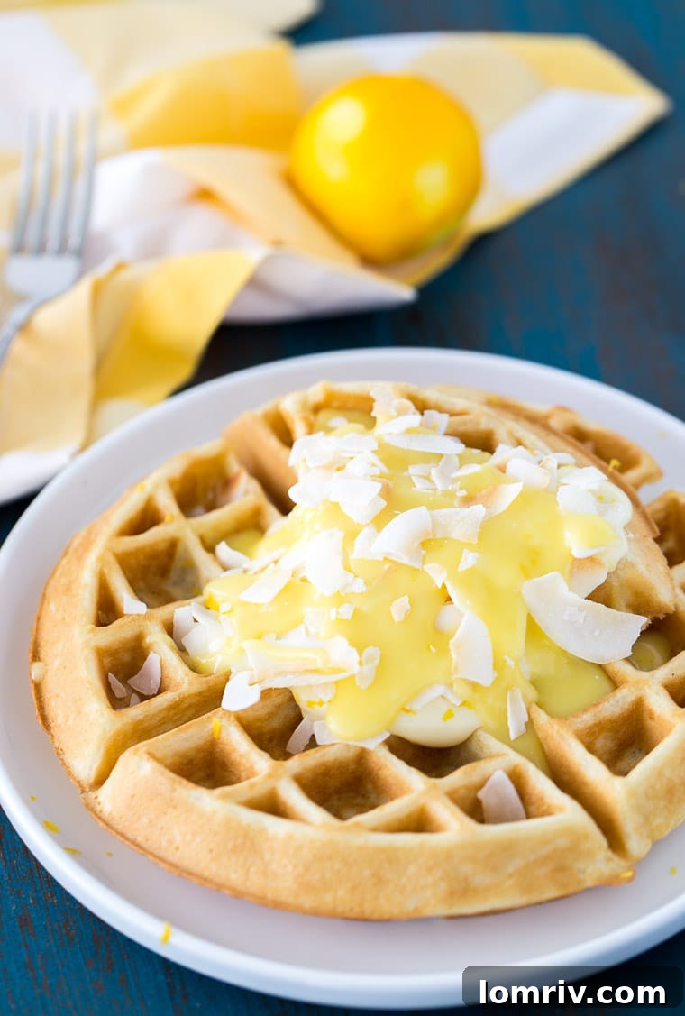These coconut lemon creme waffles takes your ordinary waffle recipe to a new level with coconut and lemon zest in the waffles to a creamy lemon pie topping. 