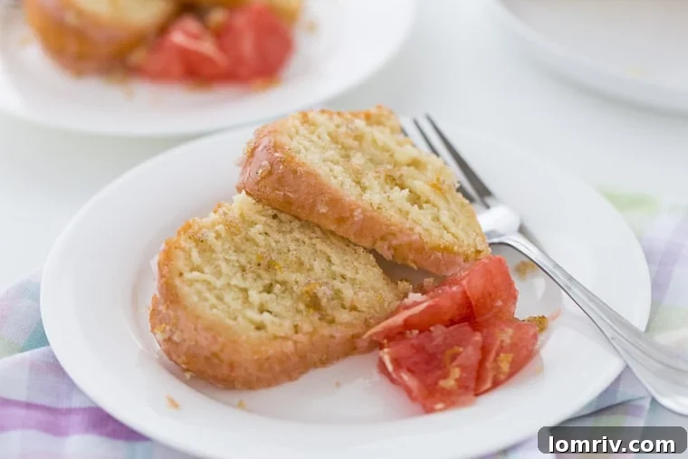 A perfectly sliced grapefruit vanilla bean pound cake revealing its tender crumb and inviting texture.