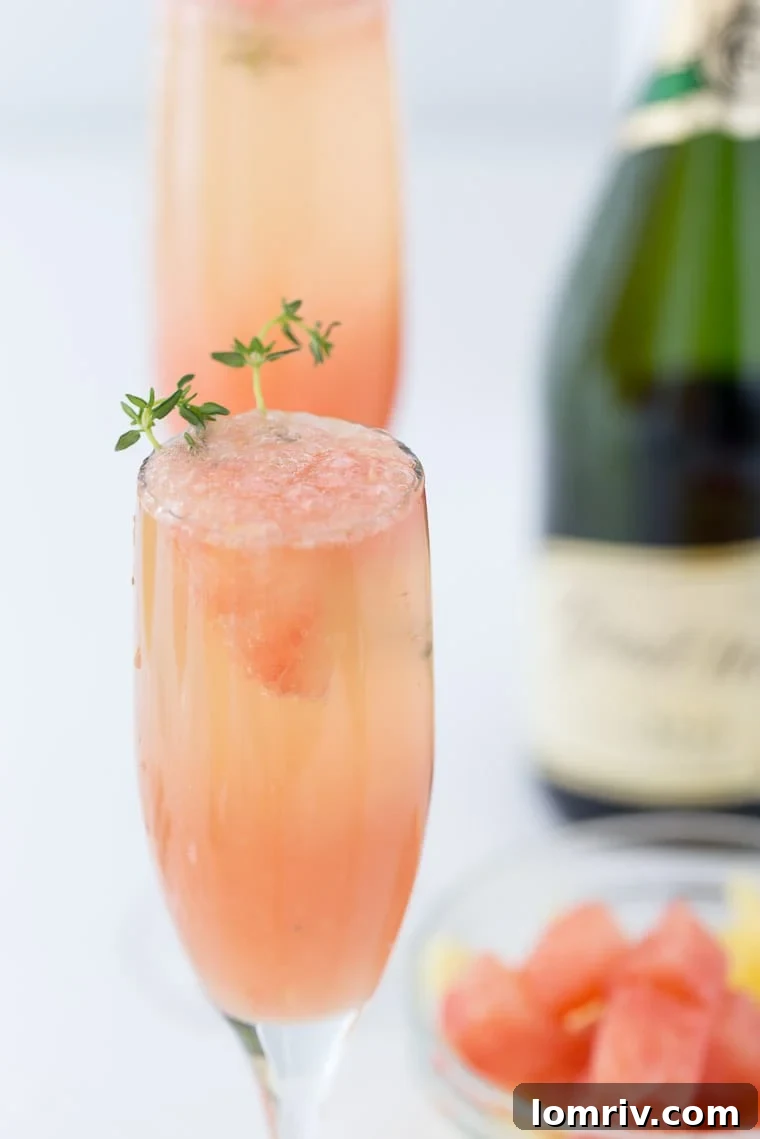 A refreshing winter mimosa, this Grapefruit Mimosa recipe is perfect for any weekend brunch with freshly squeezed grapefruit juice and fresh herbs.