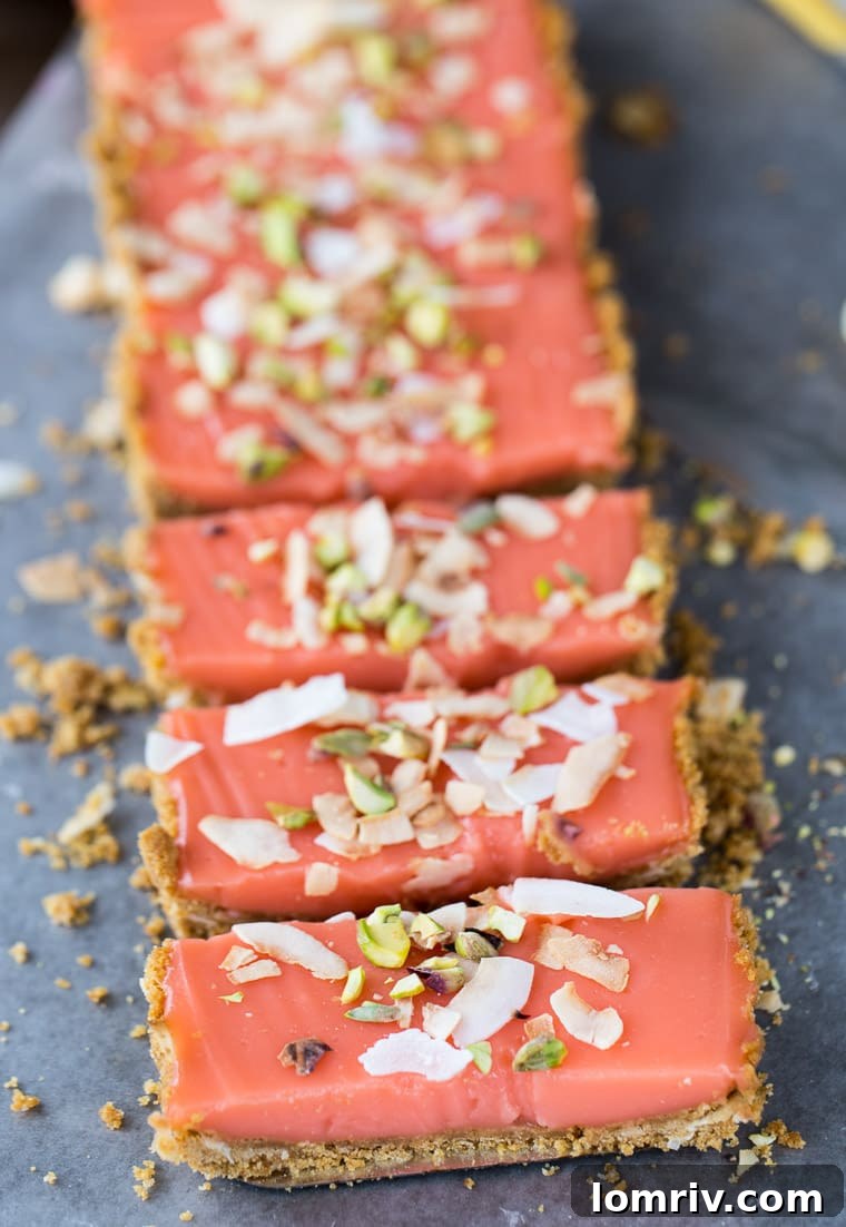 Close-up of a slice of grapefruit tart showcasing the creamy grapefruit curd and the crunchy coconut graham cracker crust.
