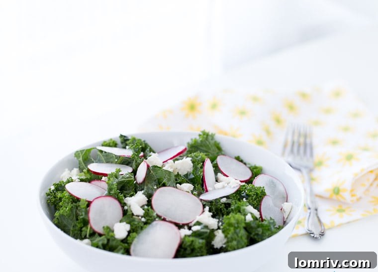 A close-up shot of a vibrant homemade kale salad, featuring crisp radishes, toasted pepitas, and crumbled queso fresco, glistening with a fresh lime vinaigrette.
