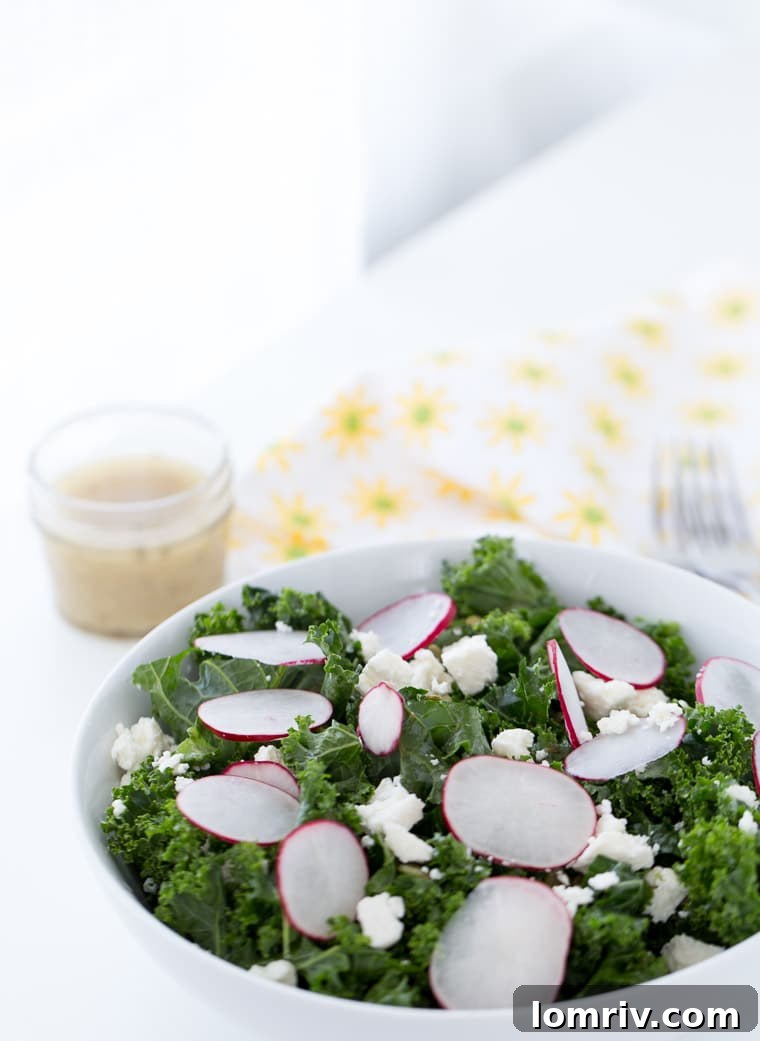 A simple and delicious homemade kale salad with radishes, pepitas, cojita cheese and lime vinaigrette. Light and fresh for a side dish or meal.