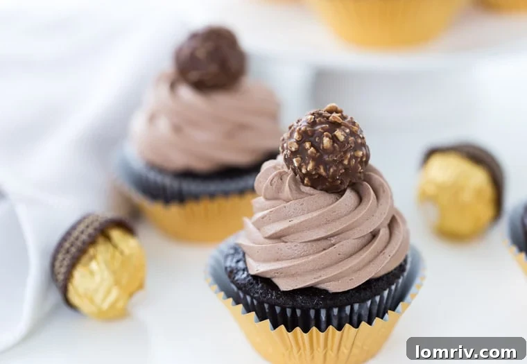 Close-up of a decadent Ferrero Rocher Cupcake with rich frosting.