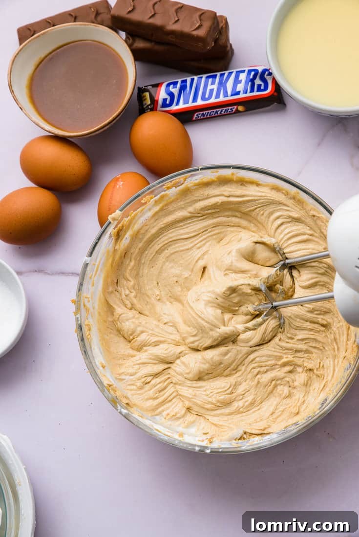 Mixing peanut butter cheesecake filling ingredients