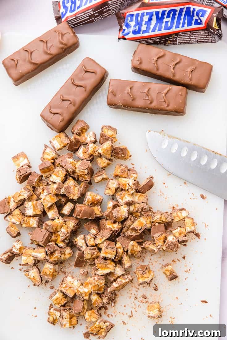 Finely chopped Snickers bars ready to be folded into batter