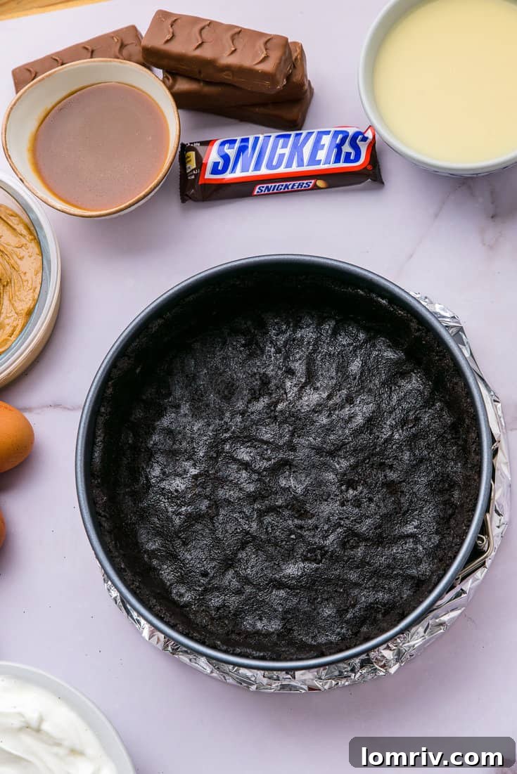 Oreo crust pressed into a springform pan