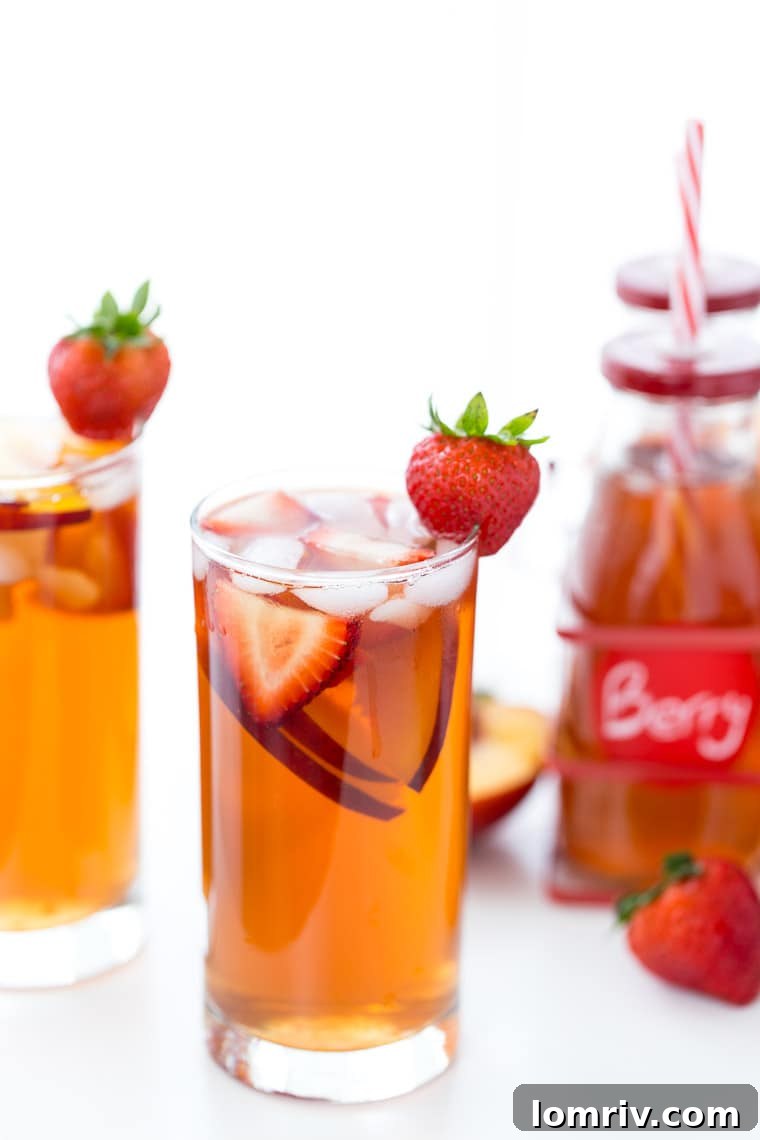 Homemade Strawberry Peach Iced Tea, a perfect refreshing summer drink bursting with fresh fruit flavor