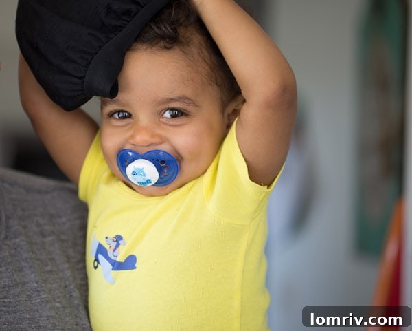 Adorable baby playing peek-a-boo, a sweet distraction