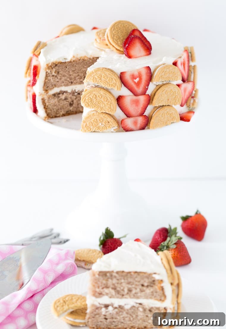 A fun and beautiful strawberry cookie cake decorated with fresh strawberries and birthday cake oreo cookies. Perfect for any birthday! 