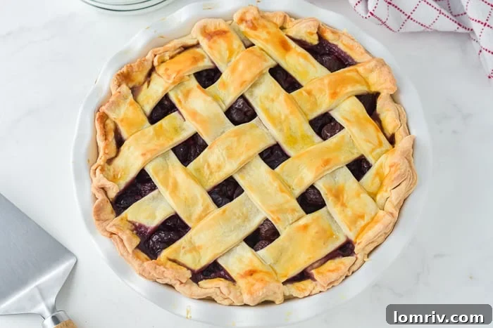 Freshly baked Cherry Bourbon Pie cooling after coming out of the oven