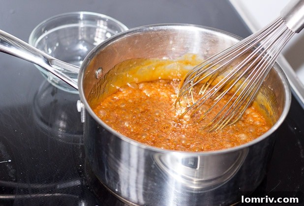 Whisking butter into hot caramel
