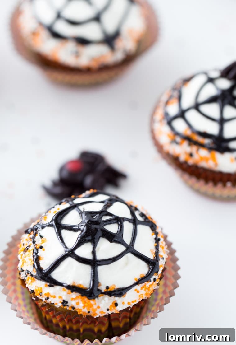 Close-up of Spiderweb Cupcakes with Maple Cream Cheese Frosting