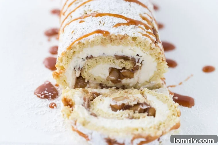 Close-up of a slice of Apple Pie Cake Roll with mascarpone cream