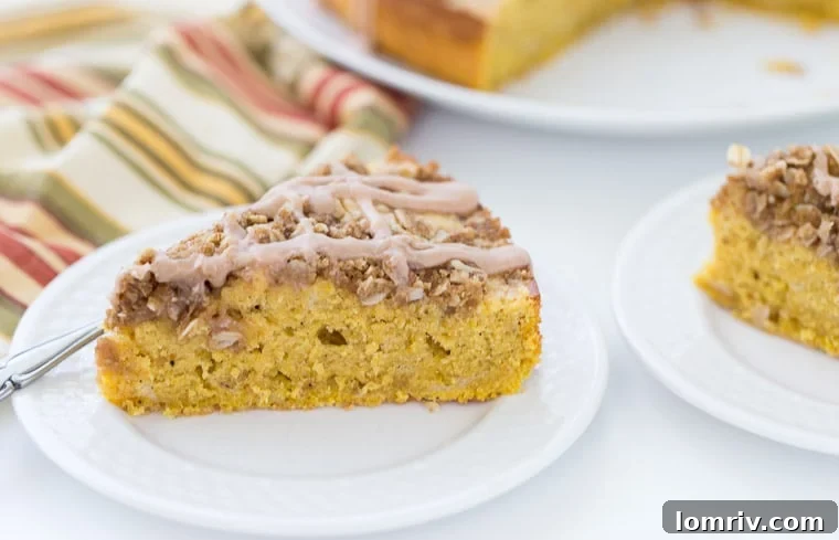An overhead shot of the Pumpkin Spice Latte Coffee Cake, showcasing its inviting layers, the golden-brown streusel, and a drizzle of sweet icing, ready to be enjoyed.
