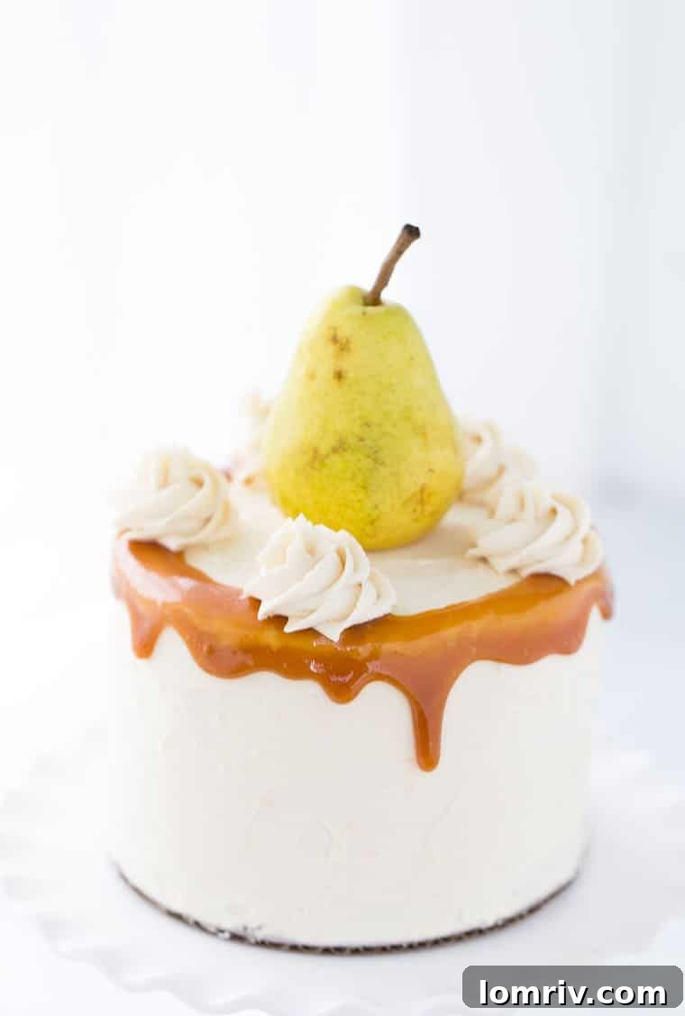Moist spiced pear cake with luscious honey caramel frosting, perfect for fall