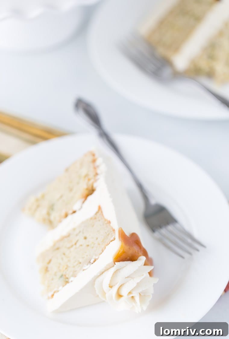 Slice of spiced pear cake revealing tender, fruit-filled crumb