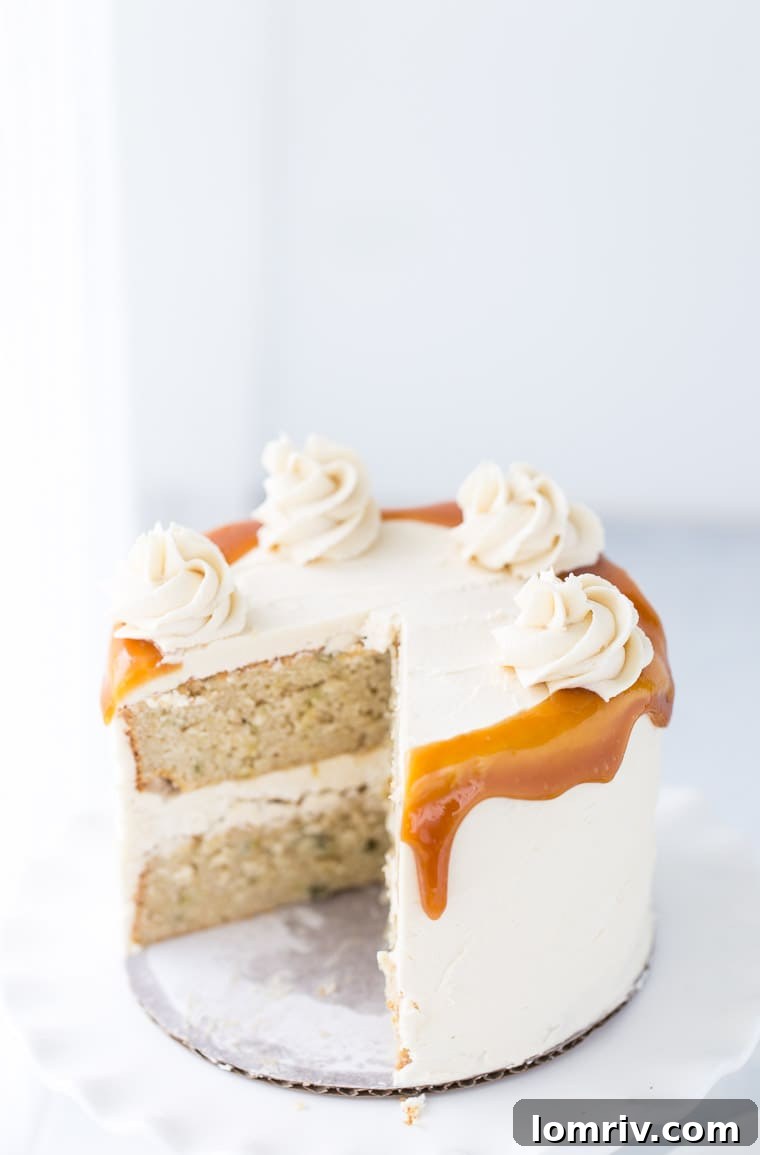 Elegant serving of Spiced Pear Cake topped with smooth honey caramel frosting