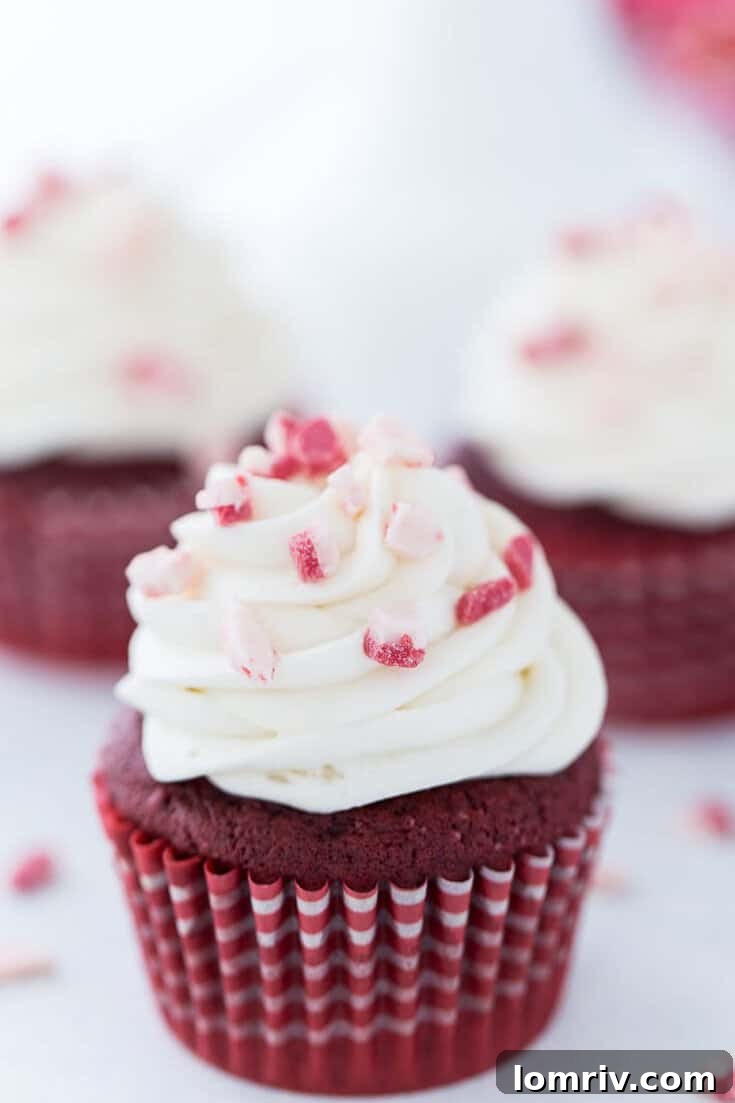 Moist and fluffy peppermint red velvet cupcakes with a hint of chocolate and a refreshing peppermint kick, perfect for holiday gatherings.