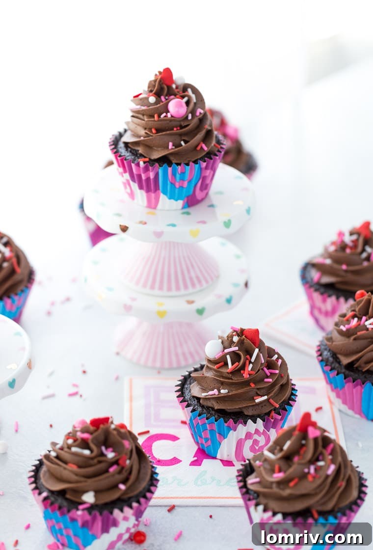 Close-up of a perfectly frosted chocolate cupcake with chocolate buttercream, ready for Valentine's Day celebrations.