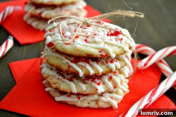 Festive Peppermint Shortbread Cookies with red and white swirls for holiday parties
