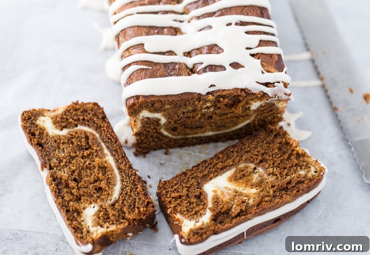 A delicious slice of Gingerbread Latte Cake with Maple Glaze, showcasing the visible cream cheese swirl and moist, tender crumb.