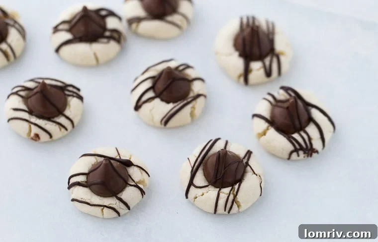 These melt in your mouth Shortbread Thumbprint Cookies with chocolate kisses are a simple yet delightful classic.