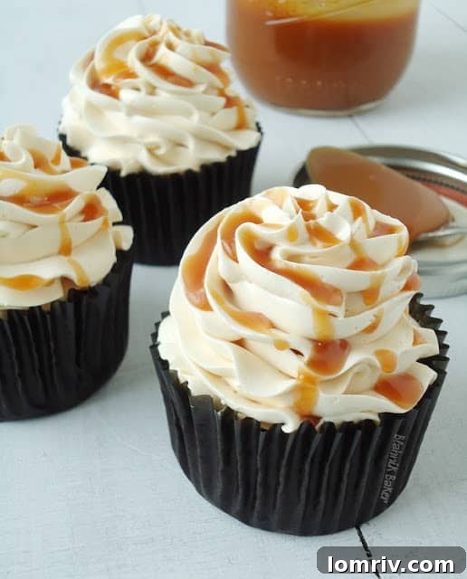 Dark Chocolate Salted Caramel Cupcakes - A decadent chocolate cupcake with salted caramel drizzled over mocha buttercream frosting. | BlahnikBaker.com