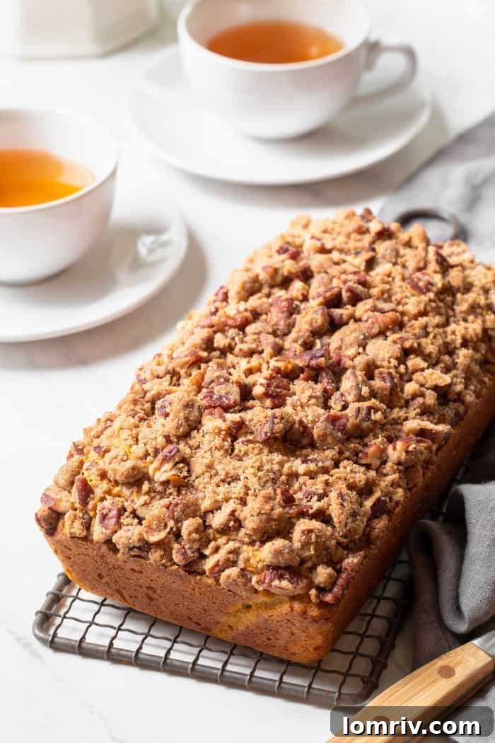 Several slices of Brown Butter Pumpkin Sage Bread displayed beautifully, showcasing the moist interior.