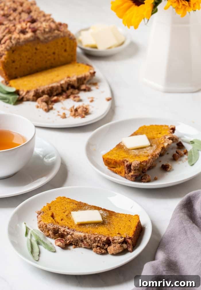 Beautifully sliced Brown Butter Pumpkin Sage Bread arranged on a platter, ready to be enjoyed.