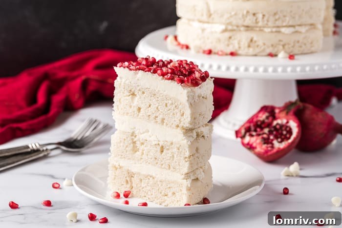 Close-up of White Chocolate Vanilla Cake with Pomegranate Garnish