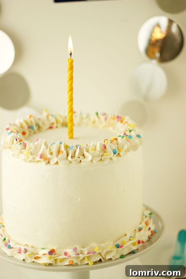 A stunning Cherry Vanilla Champagne Cake, perfect for marking special occasions and New Year's Eve. Learn how to bake this festive dessert on AClassicTwist.com